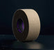 Roll of brown tape with a black border on a dark background